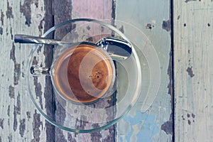 Coffee cup on wooden table in vintage