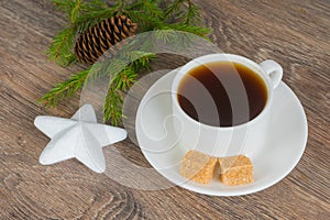 Coffee cup with xmas tree branch and star bauble