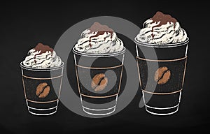 Coffee cups in three sizes with whipped cream