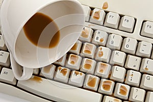 Coffee and damaged computer keyboard