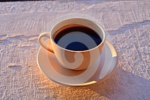 Coffee at dawn is the best way to start the day. Terrace, silence and the first rays of the sun. photo