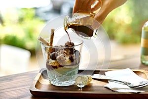 Coffee and dessert, Pouring coffee drink in sweet ice-cream affogato.