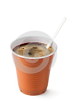 Coffee in disposable cup with plastic spoon