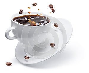 Coffee drink and coffee beans splashing from cup of coffee isolated on white background. Conceptual coffee drink image