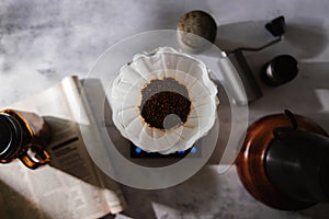 Coffee Drip Concept. Home Brew. Coffee Equipment Lay on the Cement Table. Top View with Natural Sunlight