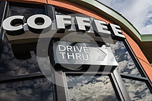 Coffee drive thru sign with reflect from glass window