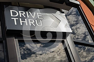 Coffee drive thru sign with reflect from glass window