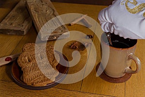 Coffee and Dutch spiced bisquit called speculaas