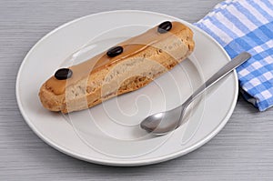 French coffee eclair served on a plate