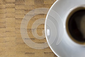 Coffee Espresso on a white plate and wooden background photo