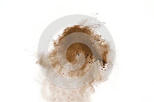 Coffee explosion isolated on white background.Explosion of brown powder, isolated on white background