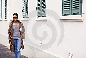 Coffee, fashion and woman on holiday, street and happy to explore city of Cape Town and sightsee. Adult, female person