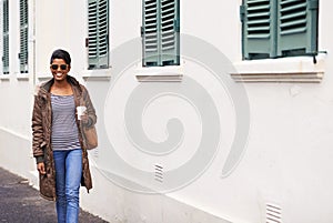Coffee, fashion and woman on holiday, street and happy to explore city of Cape Town and sightsee. Adult, female person photo