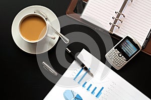 Coffee and financial data photo