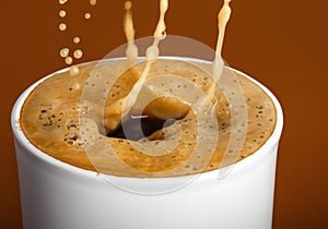 Coffee and foam splashing out of mug