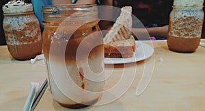 Coffee frappes and a sandwich platter on a wooden table photo