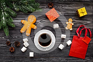 Coffee with gingebread cookies and gifts in christmas evening. Grey stone background top view