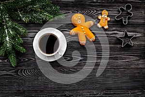 Coffee with gingebread cookies and gifts in christmas evening. Grey stone background top view