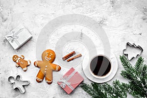 Coffee with gingebread cookies and gifts in christmas evening. Grey stone background top view copyspace