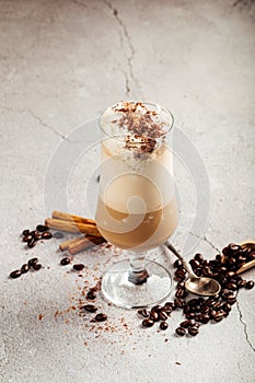 Coffee glace in a glass with beans and cinnamon