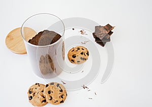 Coffee in the glass jar and chocolate cookies