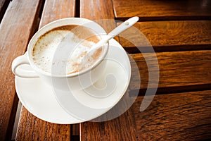 Coffee and glass on a wooden table