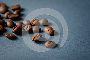 Coffee grain blue background top view. Textured background for the design