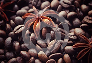 coffee grains and star anise on a wooden table, brown abstract background, warm texture, macro