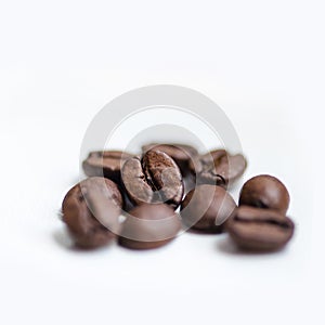 Coffee grains on white background