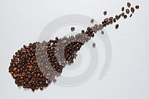 Coffee grains on white table