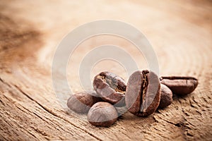 Coffee grains on wooden table