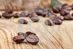 Coffee grains on wooden table