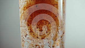 Coffee in granules dissolves in water, subject shooting of a glass of water and preparation of a drink.