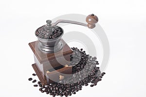 Coffee grinder with arabica coffee beans on white