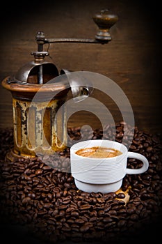 Coffee Grinder with Beans and coffe cup