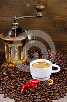 Coffee Grinder with Beans and coffe cup