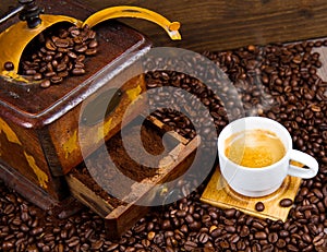 Coffee Grinder with Beans and coffe cup