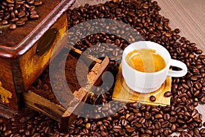 Coffee Grinder with Beans and coffe cup