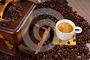 Coffee Grinder with Beans and coffe cup