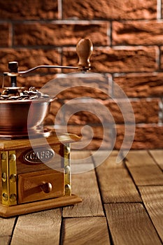 Coffee grinder with beans on the table