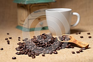 Coffee grinder and coffee beans.