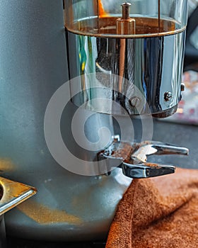 Coffee grinder. A machine that needs to grind coffee beans into powder.  Metal Material. Coffee shop equipment