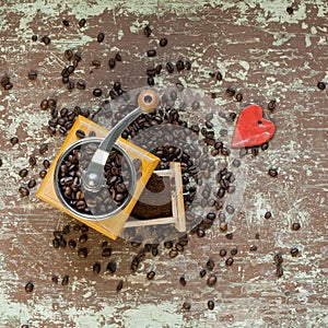 Coffee grinder on wooden board