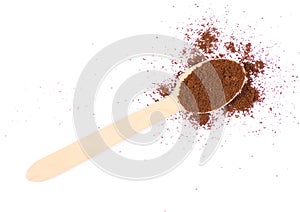 Coffee ground wooden spoon on a white background