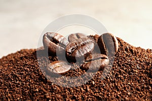 Coffee grounds and roasted beans on table photo