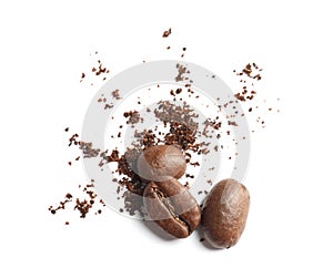 Coffee grounds and roasted beans on white background