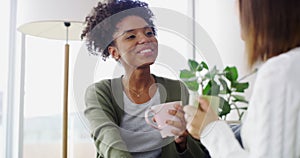 Coffee, happy and girl friends in conversation in the living room bonding, laughing and talking together. Speaking