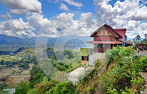 Coffee house on the road with view of green rice field in Tana Toraja