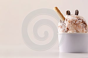 Coffee ice cream cup on table isolated close up