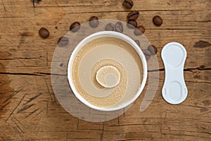 Coffee ice cream cup on wood table